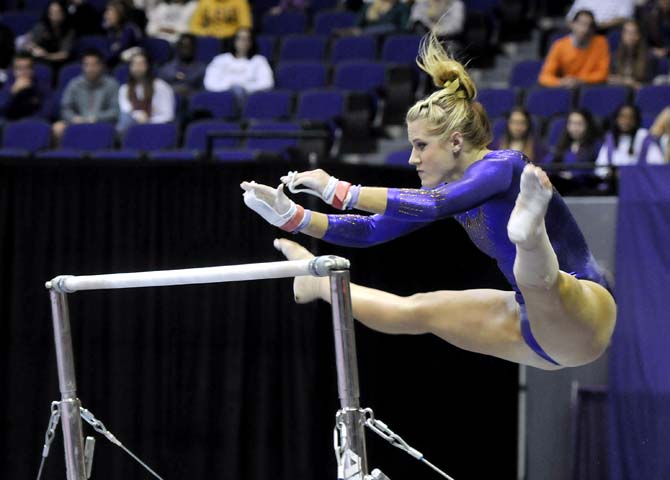 LSU junior all-around Sarie Morrison prepares to grab onto the uneven bars on Friday, Feb. 15, 2013 during the Tiger's 196.825-195.625 win over the Arkansas Razorbacks in the PMAC.
 