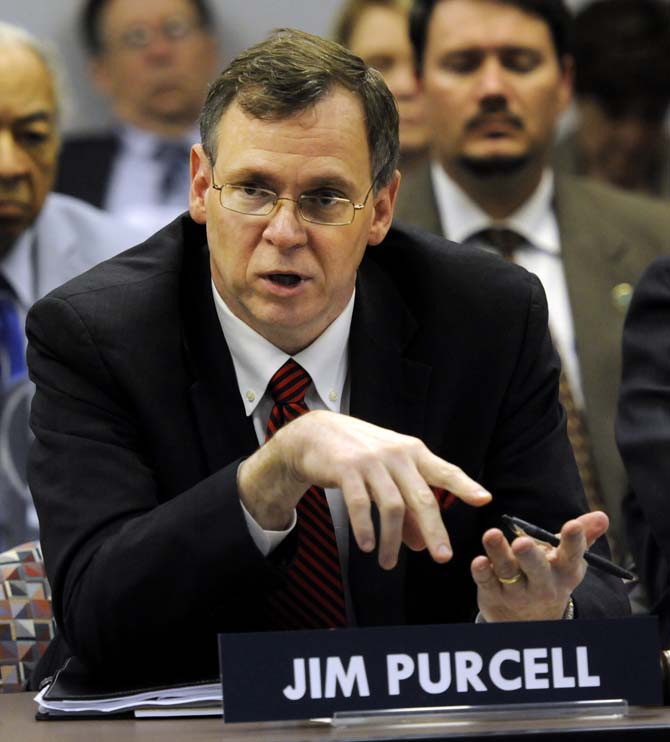 Commissioner of Higher Education Jim Purcell discusses a motion with Louisiana Board of Regents members at a meeting on Feb. 25, 2013, at the Pennington Biomedical Research Conference Center.
 