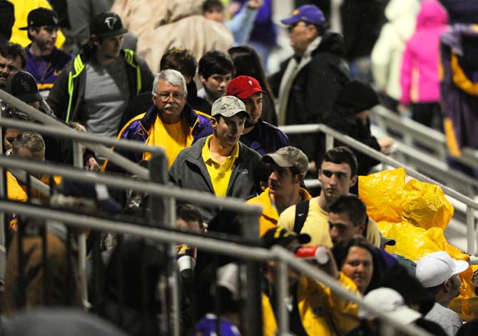 Fans leave Alex Box Stadium Feb. 22, 2013 after strong showers delayed LSU's game with Southeastern until Feb. 24.
 