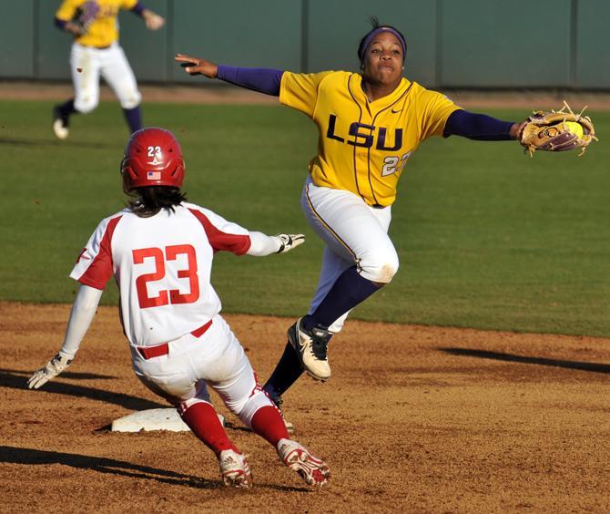 LSU freshman shortstop Bianka Bell (27) saves Sunday, Feb. 17, 2013 an overthrow from reaching the outfield during the 1-0 victory over Nicholls State at Tiger Park.
 