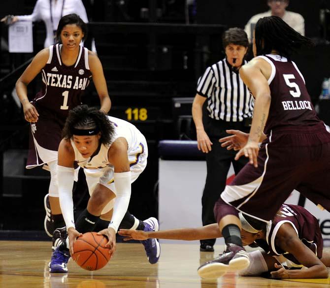 LSU freshman guard Danielle Ballard (32) steals the ball from an Aggie defender Monday, Feb. 4, 2013. The game was a 57-74 loss against the Aggies.
 