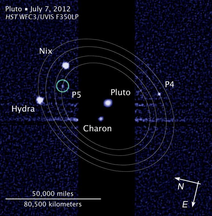 FILE -This file photo provided and annotated by NASA/Hubble Space Telescope shows the five moons in their orbits around Pluto. An online vote to name Pluto's two newest, itty-bitty moon concluded Monday, Feb. 25, 2013, and the winner is Vulcan, a name suggested by actor William Shatner, who played Capt. Kirk in the original "Star Trek" TV series. (AP Photo/NASA/Hubble Space Telescope)
 