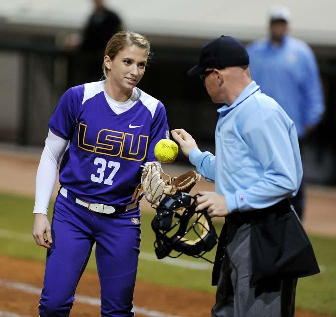 Senior LSU pitcher Rachele Fico is handed a ball on Friday, Feb. 8, 2013 at the tiger's first game of the season against North Carolina at Tiger Park.
 