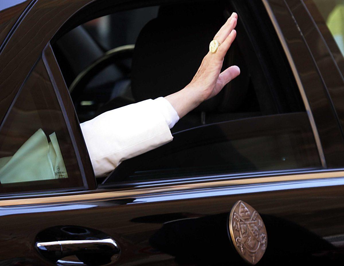 FILE - This Nov. 3, 2006 file photo shows Pope Benedict XVI's hand as he waves to faithful from his car at the end of his visit at the Pontifical Gregorian University in Rome. (AP Photo/Gregorio Borgia, files)