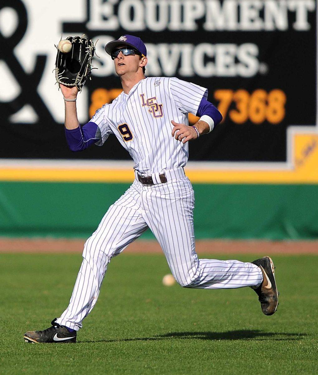 LSU Freshman Mark Laird catches Tuesday, Feb. 5, 2013 fly balls during practice at Alex Box Stadium.