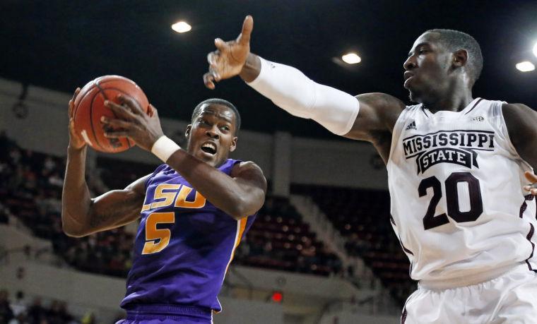 LSU forward Shavon Coleman (5) pulls away an offensive rebound from Mississippi State forward Gavin Ware (20) in the second half of an NCAA college basketball game in Starkville, Miss., Saturday, Feb. 2, 2013. LSU won 69-68. (AP Photo/Rogelio V. Solis)
 