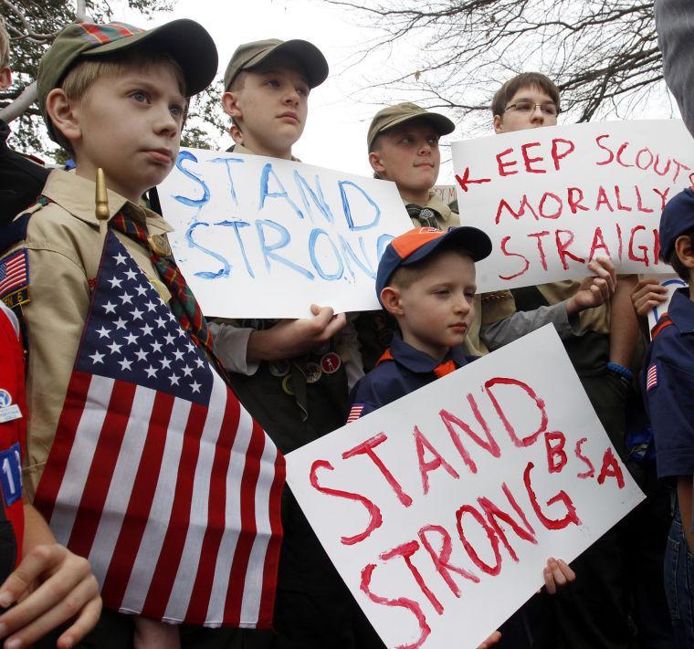 Clockwise from left, Boy Scouts Eric Kusterer, Jacob Sorah, James Sorah, Micah Brownlee and Cub Scout John Sorah hold signs at the &#8220;Save Our Scouts&#8221; Prayer Vigil and Rally in front of the Boy Scouts of America National Headquarters in Irving, Texas, Wednesday, February 6, 2013. The Boy Scouts of America said Wednesday it needed more time before deciding whether to move away from its divisive policy of excluding gays as scouts or adult leaders. (AP Photo/Richard Rodriguez)
 