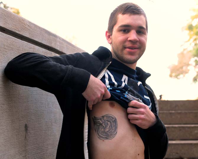 Information Systems and Decision Sciences freshman Brandon Landry showcases his tattoo in front of the union Tuesday, Feb. 26, 2013. His tattoo symbolizes independence, and stands as a reminder to ensure that money does not take over his life or relationships.
 