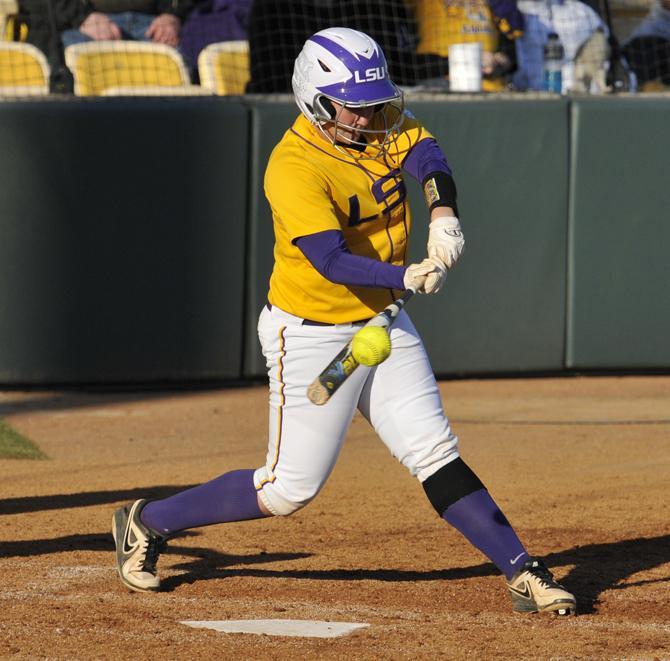 LSU senior catcher Lauren Houston contacts Sunday, Feb. 17, 2013 the softball during the 1-0 victory over Nicholls State at Tiger Park.
 