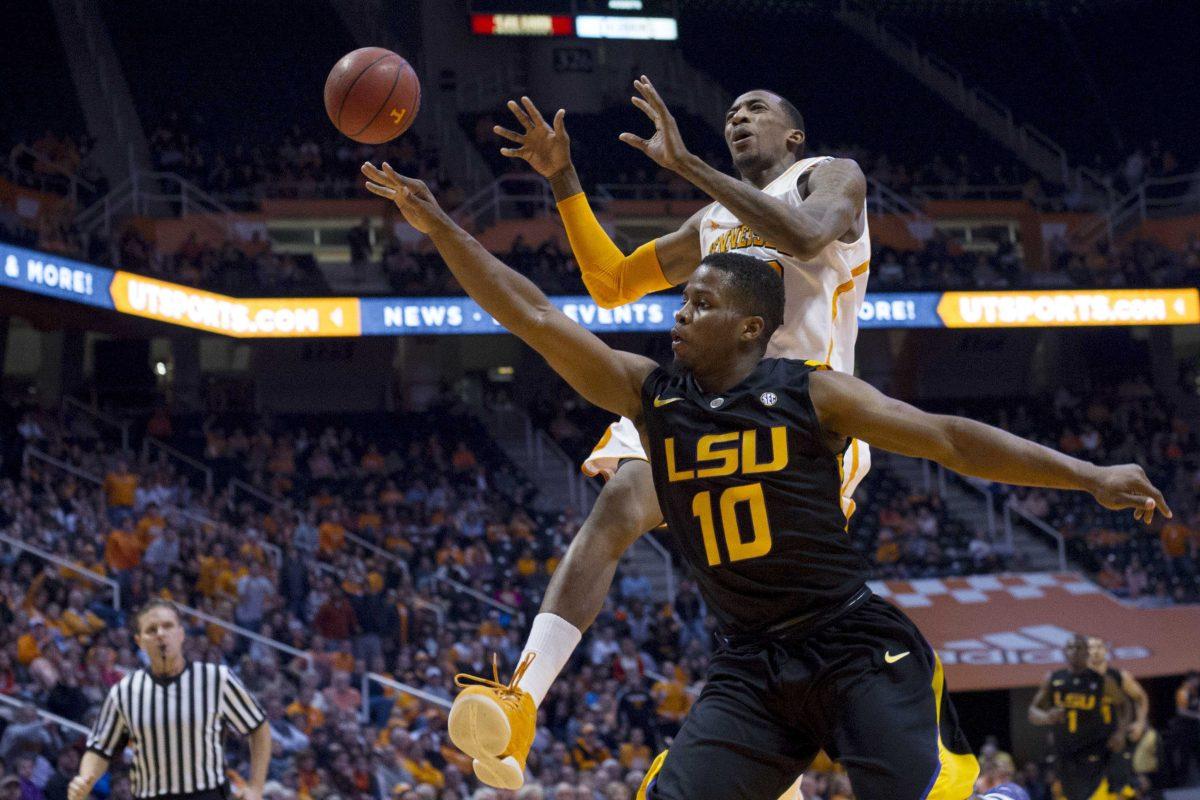 LSU's Andre Stringer (10 knocks the ball away from Tennessee's Jordan McRae during the first half of an NCAA college basketball game Tuesday, Feb. 19, 2013, in Knoxville, Tenn. (AP Photo/The Knoxville News Sentinel, Saul Young)