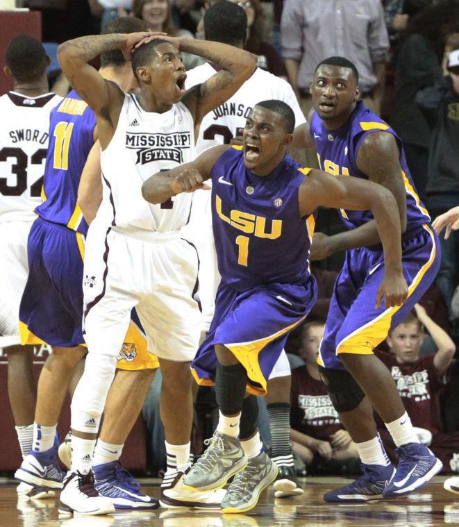 LSU guard Anthony Hickey starts to celebrate after hitting the game-winning shot shot against Mississippi State during an NCAA college basketball game Saturday, Feb. 2, 2013, in Starkville, Miss. LSU won 69-68. (AP Photo/Northeast Mississippi Daily Journal, Thomas Wells)
 