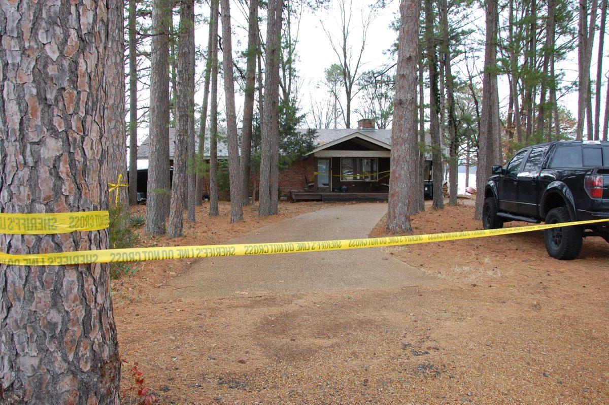 Yellow crime-scene tape blocks off the Heber Springs, Ark., home Monday, Feb. 18, 2013 where authorities say country music singer Mindy McCready died in an apparent suicide. McCready died in an apparent suicide Sunday at her home in Heber Springs, a vacation community about 65 miles north of Little Rock. She was found dead on the front porch, the same place where her boyfriend, musician David Wilson, died last month of a gunshot wound to the head. (AP Photo/Jeannie Nuss)