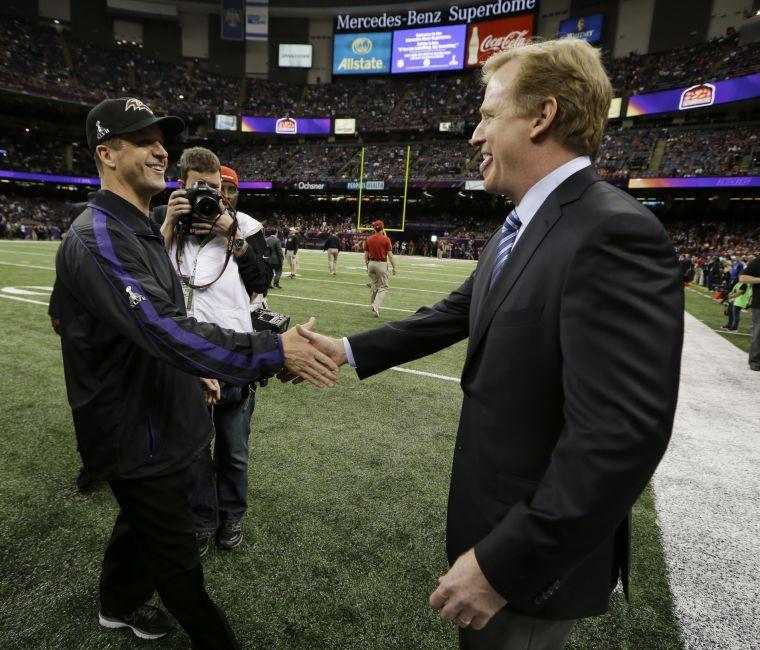 Baltimore Ravens head coach John Harbaugh, left, and NFL Commissioner Roger Goodell shake hands before the NFL Super Bowl XLVII football game between the Ravens and the San Francisco 49ers, Sunday, Feb. 3, 2013, in New Orleans. (AP Photo/Matt Slocum)
 