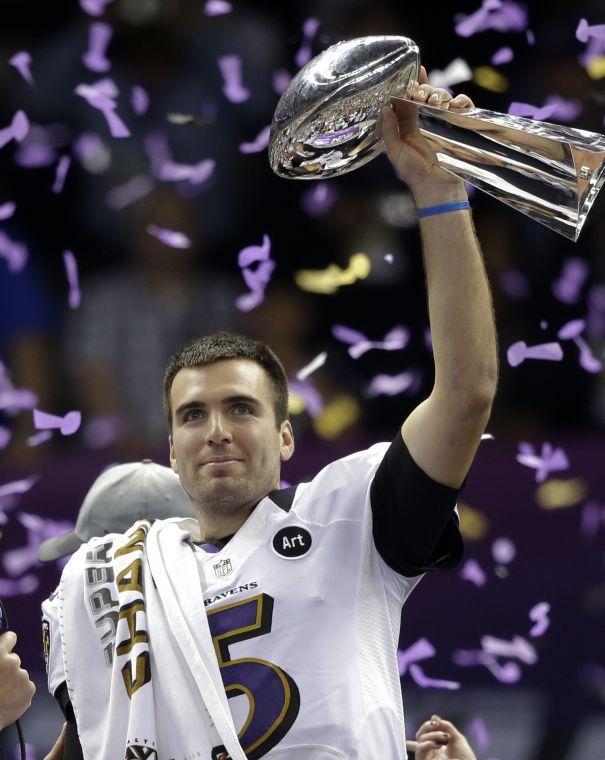 Baltimore Ravens quarterback Joe Flacco holds up the Vince Lombardi Trophy after their 34-31 win against the San Francisco 49ers in the NFL Super Bowl XLVII football game, Sunday, Feb. 3, 2013, in New Orleans. (AP Photo/Marcio Sanchez)
 