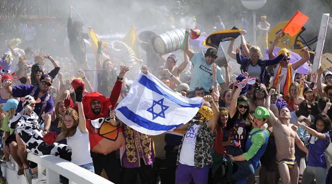 A large group of LSU students go crazy once the beat drops on Feb. 15, 2013 during the LSU Harlem Shake in front of the PMAC.
 