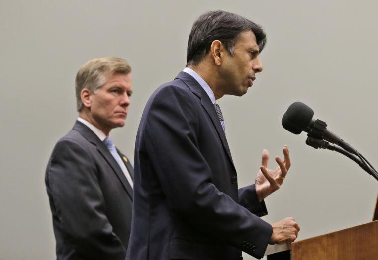 Louisiana Gov. Bobby Jindal, right, gestures as he and Virginia Gov. Bob McDonnell, left, address the press during a news conference Friday, Feb. 8, 2013 in Richmond, Va. The two governors discussed K-12 education reforms. (AP Photo/Steve Helber)
 