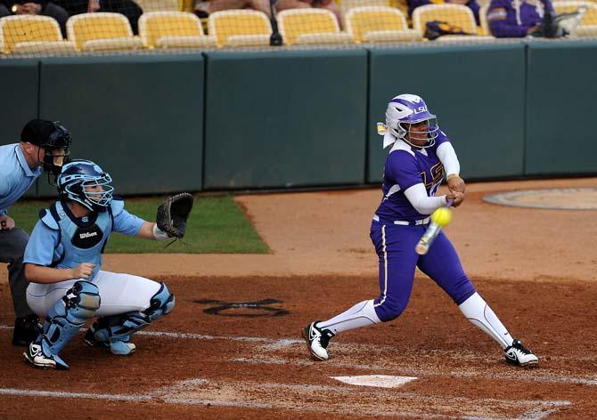 LSU freshman Bianka Bell hits the ball on Friday, Feb. 8, 2013 during the tiger's first game of the season against North Carolina at Tiger Park.
 