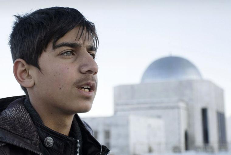 In this Wednesday, Feb. 6, 2013 photo, Afghan actor Fawad Mohammadi, 14, speaks during an interview with The Associated Presson Nader Khan's hill, one of the areas where a part of the Afghani Oscar nominated short film titled &#8220;Buzkashi Boys&#8221; was shot in Kabul, Afghanistan. Fawad Mohammadi has spent half his life peddling maps and dictionaries to foreigners in the main tourist district in Kabul. Now the 14-year-old Afghan boy with beautiful green eyes is getting ready for his first airplane ride and a trip down the red carpet at the Oscars. (AP Photo/Musadeq Sadeq)
 