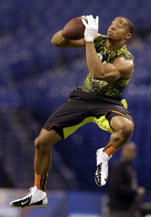 LSU defensive back Eric Reid runs a drill at the NFL football scouting combine in Indianapolis, Tuesday, Feb. 26, 2013. (AP Photo/Michael Conroy)
 