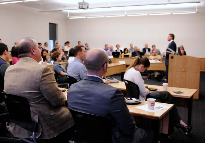 Members of the audience listen intently to President of Louisiana Chapter of the Entrepreneurs' Organization Aaron Dirks on Tuesday, Feb. 19, 2013 during the Breakfast to Business series at the Business Education Complex.