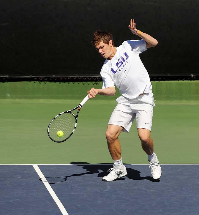 LSU sophomore Chris Simpson hits a ball Sunday, Feb. 3, 2013 during the match against USF at W.T. "Dub" Robinson Stadium.
 