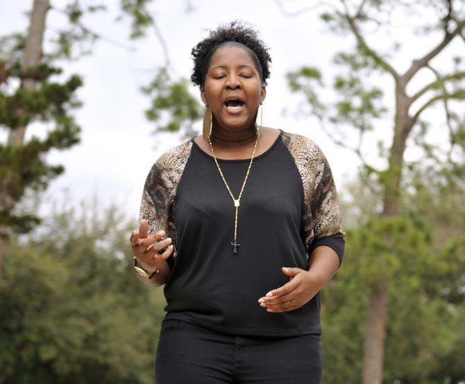 English and African-American Studies senior Jonosha Jackson practices her poetry Monday, Feb. 18, 2013. She won the "Mic with Maya" contest and will be performing original poetry Tuesday night in front of Maya Angelou.
 