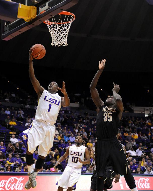 LSU sophomore guard Anthony Hickey (1) lays up Wednesday, Feb. 6, 2013 the basketball over Vanderbilt sophomore forward James Siakam (35) during the Tigers' 57-56 victory over the Commodores in the PMAC.
 