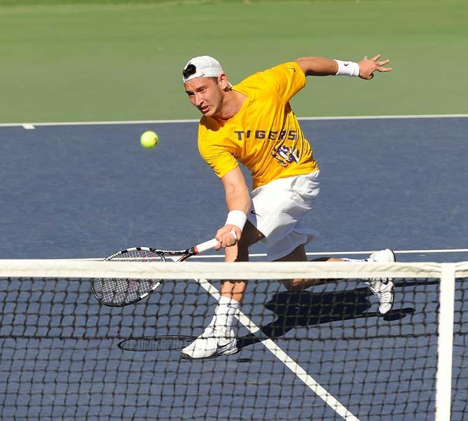 LSU Senior Olivier Borsos dives for the ball Sunday, Feb. 3, 2013 during a match against USF at W.T. "Dub" Robinson Stadium.
 