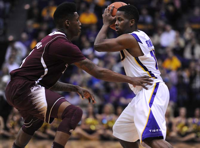 LSU junior guard Andre Stringer avoids a defender Saturday, Feb. 16, 2013 in the Tigers' 80-68 victory over the Bulldogs.
 