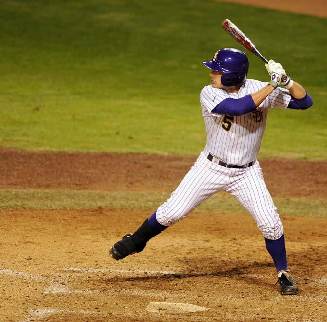 LSU sophomore Chris Sciambra (5) prepares to hit the ball on Tuesday, Feb. 19, 2013 during the Tigers' 8-1 victory against the Lamar Cardinals.
 