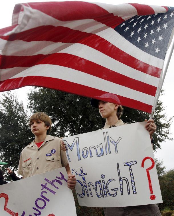 Stephen Cyr, 13, left, and his brother Paul Cyr, 15, of Boy Scout Troop 21 in Oak Cliff, Texas, attend the &#236;Save Our Scouts&#238; Prayer Vigil and Rally in front of the Boy Scouts of America National Headquarters in Irving, TX Wednesday, Feb. 6, 2013. The Boy Scouts of America said Wednesday it needed more time before deciding whether to move away from its divisive policy of excluding gays as scouts or adult leaders. (AP Photo/Richard Rodriguez)
 