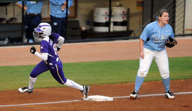 LSU sophomore A.J. Andrews runs to home plate on Friday, Feb. 8, 2013 during the tiger's first game of the season against North Carolina at Tiger Park.
 