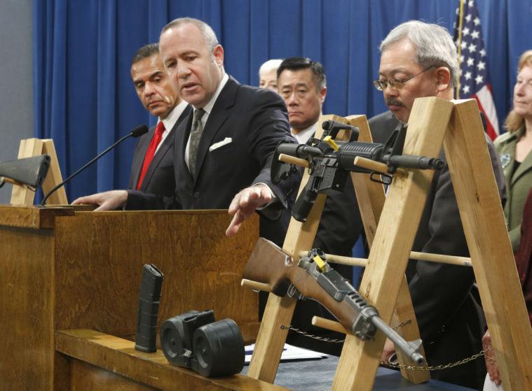 Senate President Pro Tem Darrell Steinberg, second from left, glances to a pair of semi-automatic rifles as he discusses a package of proposed gun control legislation at a Capitol news conference in Sacramento, Calif., Thursday, Feb. 7, 2013. Senate Democrats unveiled a package of 10 proposed laws designed to close loopholes in existing gun regulations, keep firearms and ammunition out of the hands of dangerous person and strengthen education relating to firearms and gun ownership. Also seen are Los Angeles Mayor Antonio Villaraigosa, left, Sen. Leland Yee, D-San Francisco, third from left, San Francisco Mayor Ed Lee, second from right. (AP Photo/Rich Pedroncelli)
 