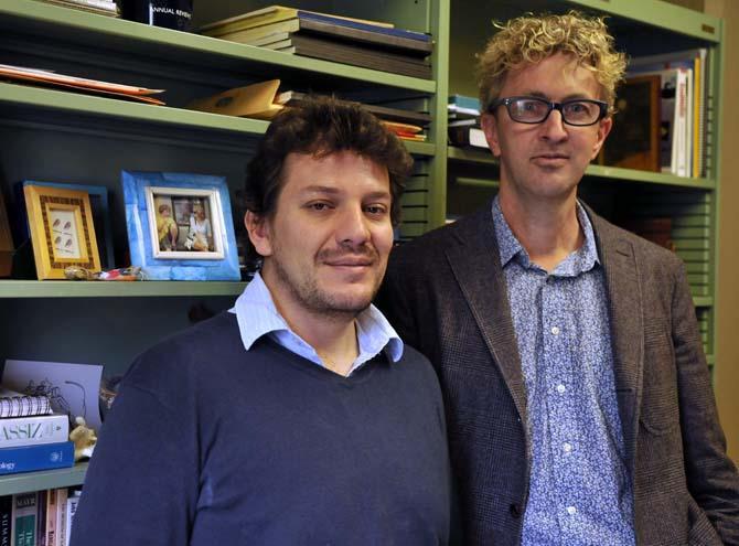 Graduate student Carlos Prada (left) and Dr. Michael Hellberg (right) stand in Dr. Hellberg's office on the third floor of the Life Sciences building Tuesday, Feb. 19, 2013. Dr. Hellberg has discovered how new coral species form in the ocean with the help of Prada's thesis and field work.
 