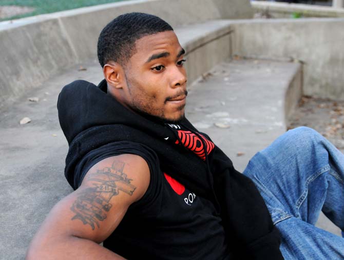 Sports administration senior Karl Acker sits in front of the union Tuesday, Feb. 26, 2013. His tattoo is a tribute to his older brother, who was stillborn, and was designed by his younger brother.
 