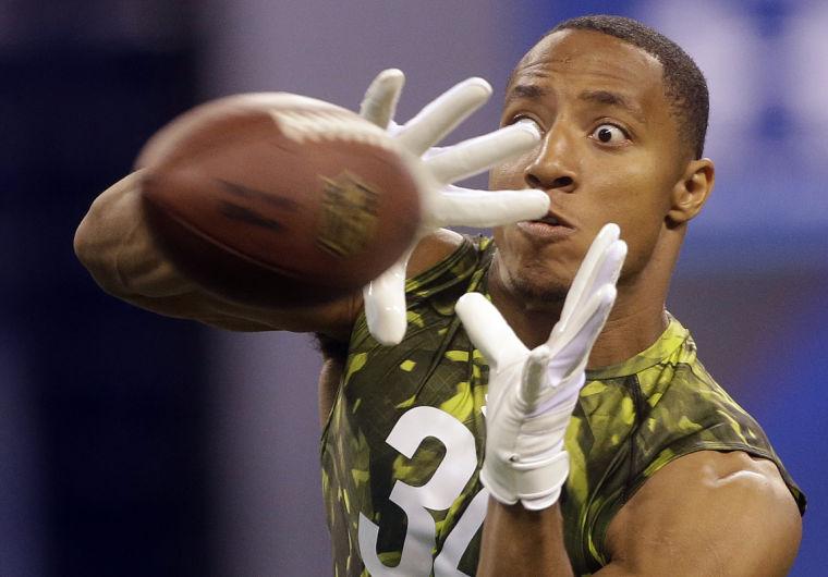 LSU defensive back Eric Reid keeps his eyes on the ball during a drill during the NFL football scouting combine in Indianapolis, Tuesday, Feb. 26, 2013. (AP Photo/Dave Martin)
 