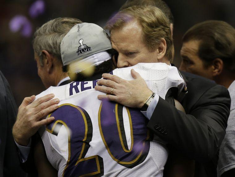 Baltimore Ravens safety Ed Reed (20) embraces NFL Commissioner Roger Goodell after defeating the San Francisco 49ers 34-31 in the NFL Super Bowl XLVII football game, Sunday, Feb. 3, 2013, in New Orleans. (AP Photo/Gene Puskar)
 