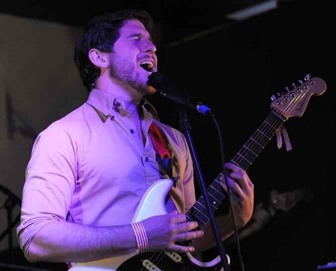 Economics sophomore and Stone Rabbits lead vocalist and guitarist Ben Burbrink sings into the microphone Saturday, Feb. 2, 2013 during a show at Shady's.
 