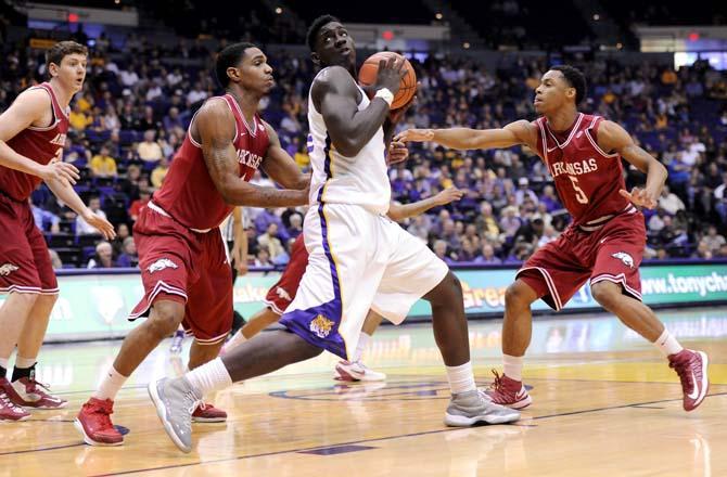 LSU sophomore forward Johnny O'Bryant III (2) attempts to keep the ball away from Arkansas defenders Wednesday Feb. 27, 2013 during the Tigers' 65-60 victory against the Razorbacks in the PMAC.
 