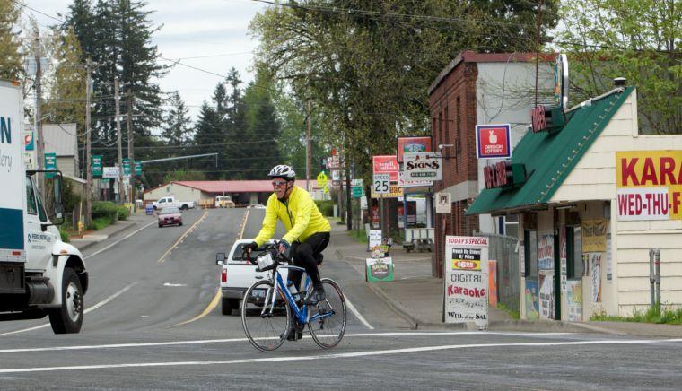 In this April 25, 2012 photo, a cyclist rides in Boring, Ore. Boring and Dull created some excitement at the Oregon Legislature on Wednesday, Feb. 20, 2013. Last year the communities of Boring, Ore. and Dull, Scotland formed a partnership, based on their snoozy names. On Wednesday, the Oregon House voted to celebrate that partnership by making Aug. 9 Boring and Dull Day. (AP Photo/The Oregonian, Doug Beghtel) MAGS OUT; TV OUT; LOCAL TV OUT; LOCAL INTERNET OUT; THE MERCURY OUT; WILLAMETTE WEEK OUT; PAMPLIN MEDIA GROUP OUT
 