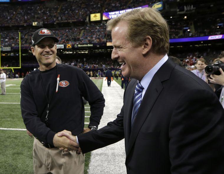 San Francisco 49ers head coach Jim Harbaugh, left, greets NFL Commissioner Roger Goodell before the NFL Super Bowl XLVII football game against the Baltimore Ravens, Sunday, Feb. 3, 2013, in New Orleans. (AP Photo/Matt Slocum)
 