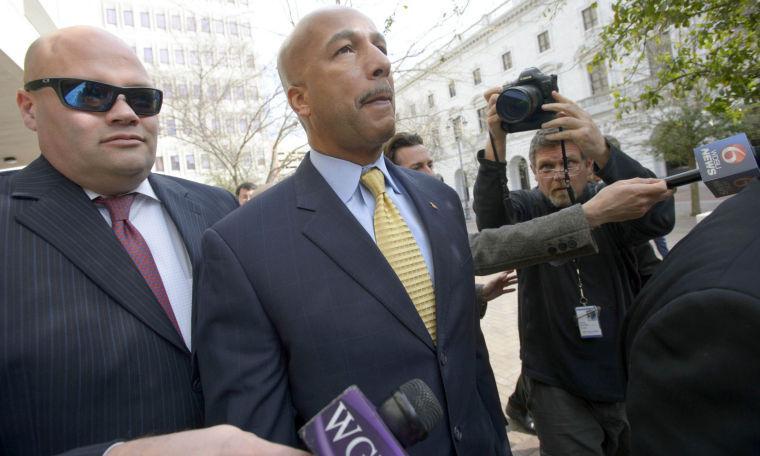 Former New Orleans Mayor C. Ray Nagin leaves the Hale Boggs Federal Building and United States District Courthouse after pleading not guilty in federal court at an arraignment on public corruption charges in New Orleans, Wednesday, Feb. 20, 2013. Nagin did not speak with reporters. (AP Photo/Matthew Hinton)
 