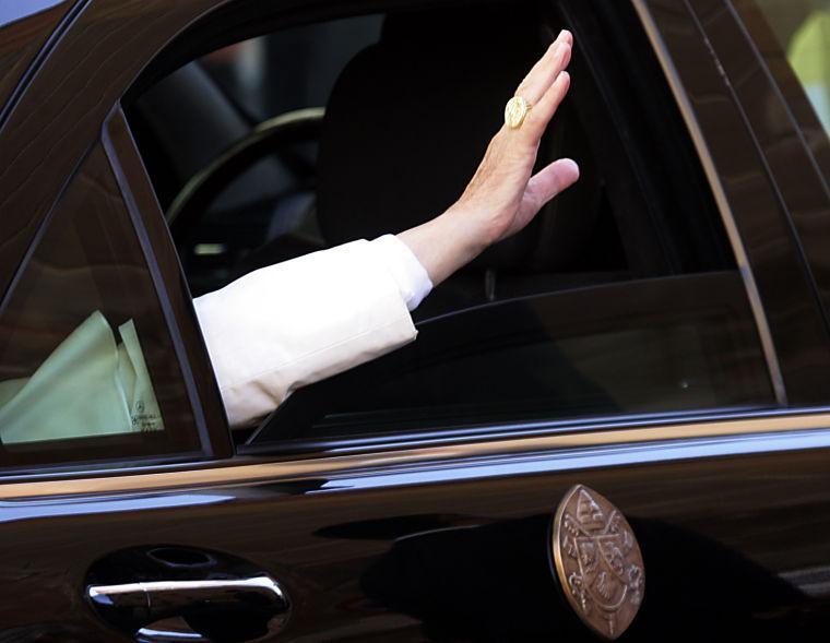 FILE - This Nov. 3, 2006 file photo shows Pope Benedict XVI's hand as he waves to faithful from his car at the end of his visit at the Pontifical Gregorian University in Rome. (AP Photo/Gregorio Borgia, files)
 