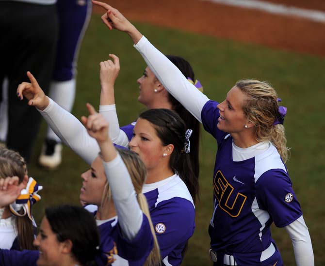 LSU sophomore Dylan Supak leads a cheer with her teammates on Friday, Feb. 8 during the tiger's first game of the season against North Carolina at Tiger Park.
 