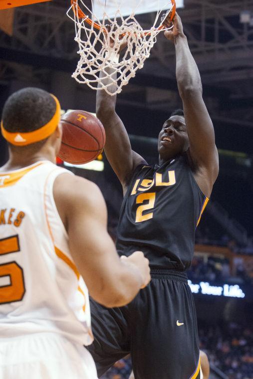 LSU's Johnny O'Bryant III scores in front of Tennessee's Jarnell Stokes during an NCAA college basketball game Tuesday, Feb. 19, 2013, in Knoxville, Tenn. Tennessee won 82-72. (AP Photo/The Knoxville News Sentinel, Saul Young)
 