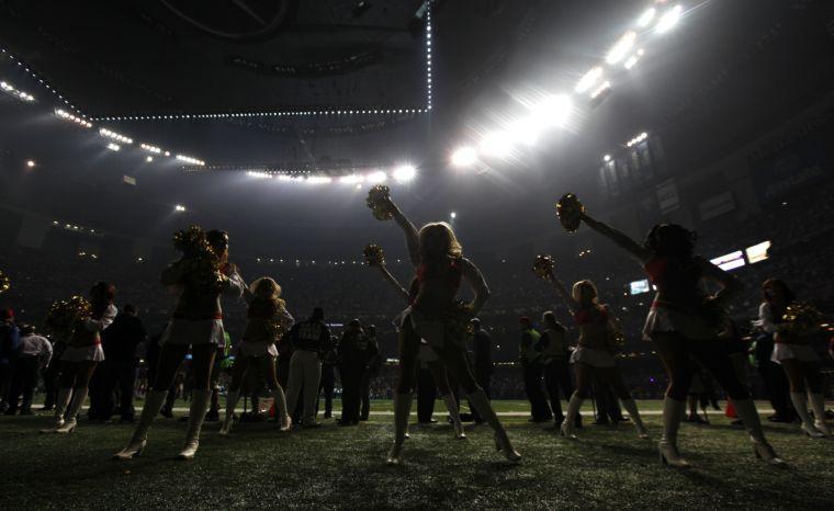 San Francisco 49ers cheerleaders perform during a power outage at the Superdome in the second half of the NFL Super Bowl XLVII football game between the 49ers and the Baltimore Ravens, Sunday, Feb. 3, 2013, in New Orleans. (AP Photo/Evan Vucci)
 