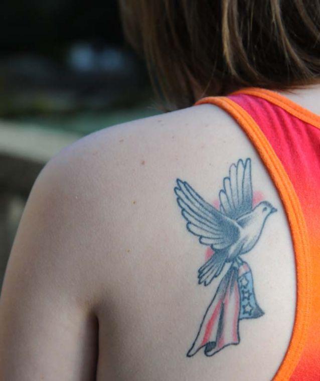 Animal Science freshman Katie Picou stands on a balcony overlooking Memorial Oak Grove Tuesday, Feb. 26, 2013. Her tattoo is a tribute to both of her grandfathers.
 