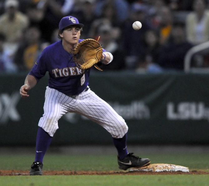 LSU senior first baseman Mason Katz (8) recieves a throw Saturday, March 23, 2013 during the 5-1 victory against Auburn at Alex Box Stadium.
 