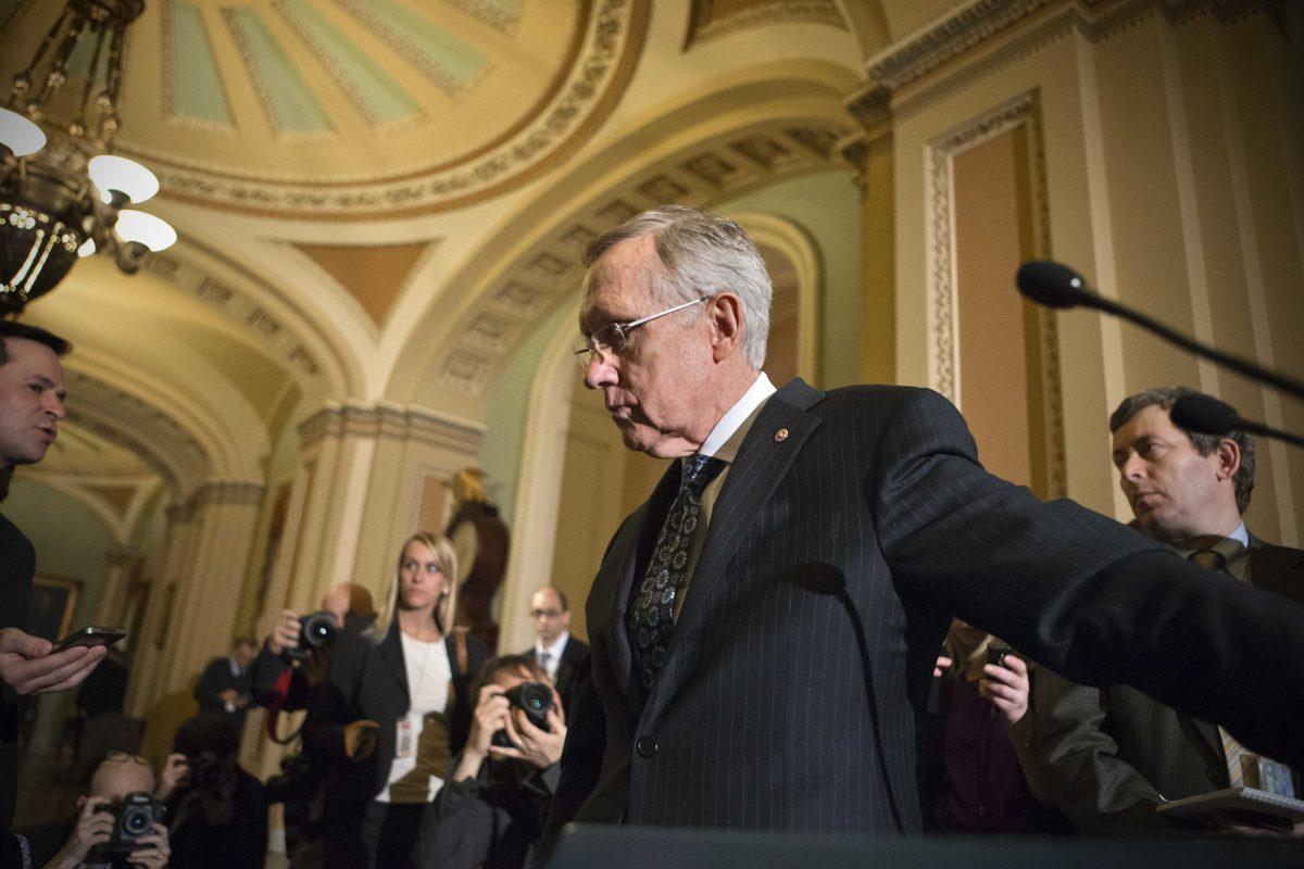 Senate Majority Leader Harry Reid, D-Nev., leaves a news conference after answering questions on the looming automatic spending cuts, at the Capitol in Washington, Tuesday, Feb. 26, 2013. Reid also responded to House Speaker John Boehner who used salty language earlier in the day to prod the Senate to act on legislation to replace the automatic spending cuts known as the sequester. (AP Photo/J. Scott Applewhite)