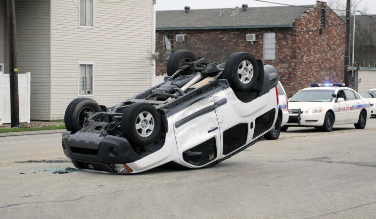 A flipped Nissan XTerra rests at West Parker Boulevard and Burbank Drive on Feb. 6, 2013.
 